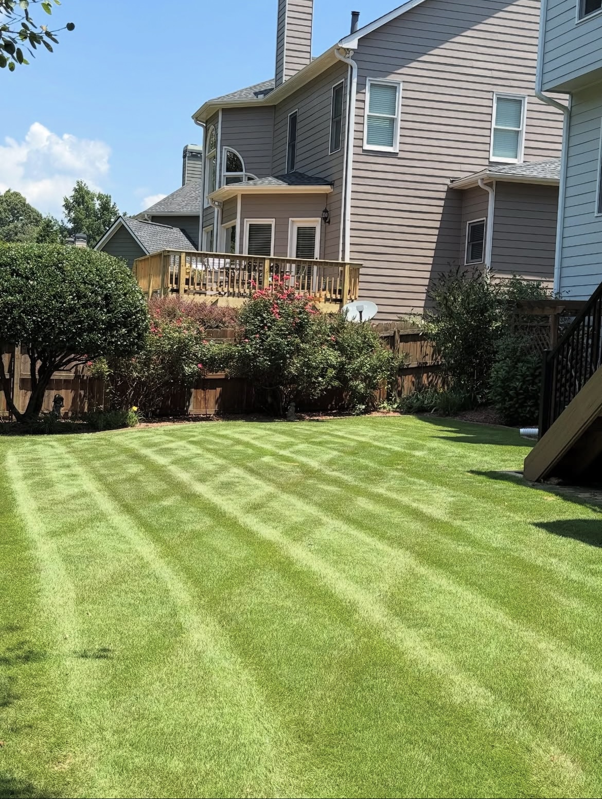 Beautifully striped lawn maintenance and care - Professional landscaping in Cumming, GA